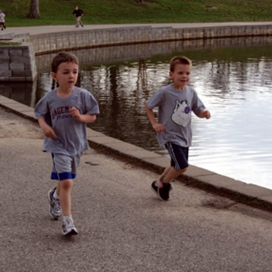 Hagemann Elementary kindergarteners Rich LaFlamme, left, and Marshall Ems participate in the schools Pond-A-Thon held on April 8 at Suson Park. Students raised nearly $3,000 in pledges for fun fitness the event, which benefited the Hagemann Parent Organization.