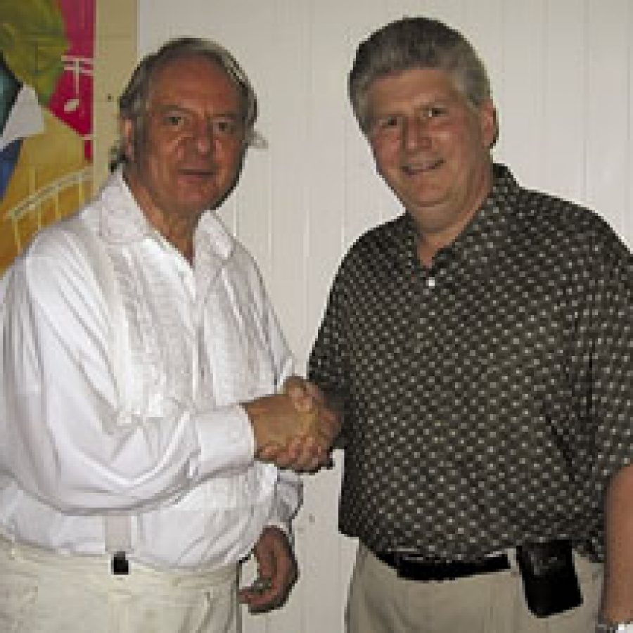 German composer Karlheinz Stockhausen, left, shakes hands with Lemay guitarist and composer Jim Stonebraker. Stonebraker personally was invited by Stockhausen to attend the Stockhausen Courses Kürten 2003 IN Kürten, Ger-many.