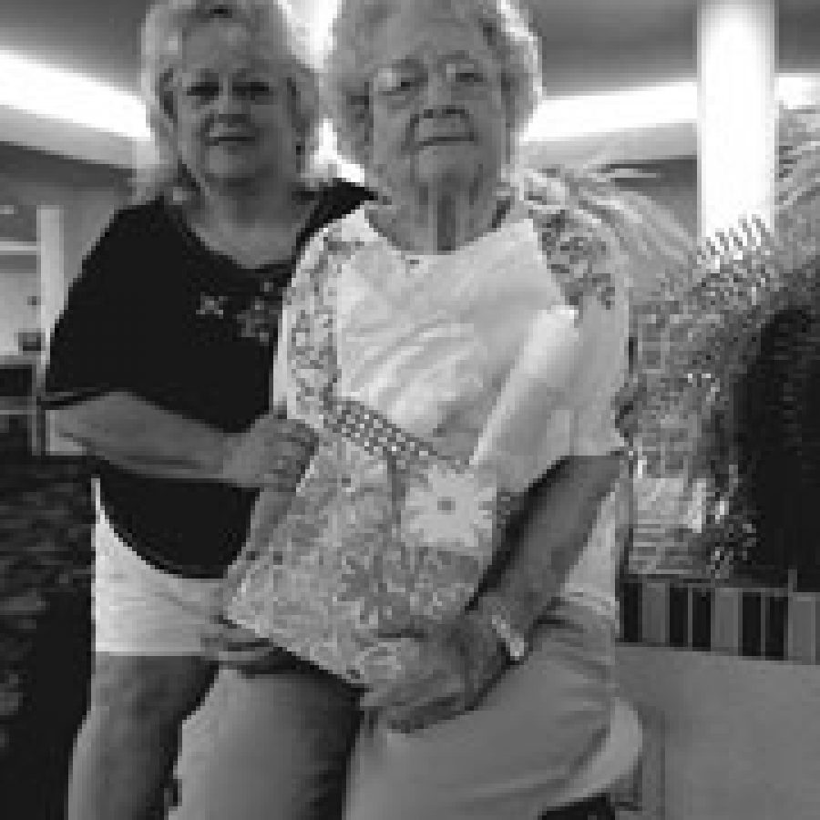 Mother of the Year runner-up Judy Ruesch, 94, right, holds her prizes with her daughter Nancy Buffa, 57, of Lemay.
Bill Milligan photo
 