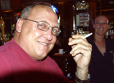 File photo: Concord resident Dan Logger opposed a 2009 smoking ban in public places because he believed it would affect businesses operated by many of his friends. Im against it, he said at the time. Also pictured is Schottzies Bar and Grill bartender Lana Sugg. Photo by Bill Milligan.