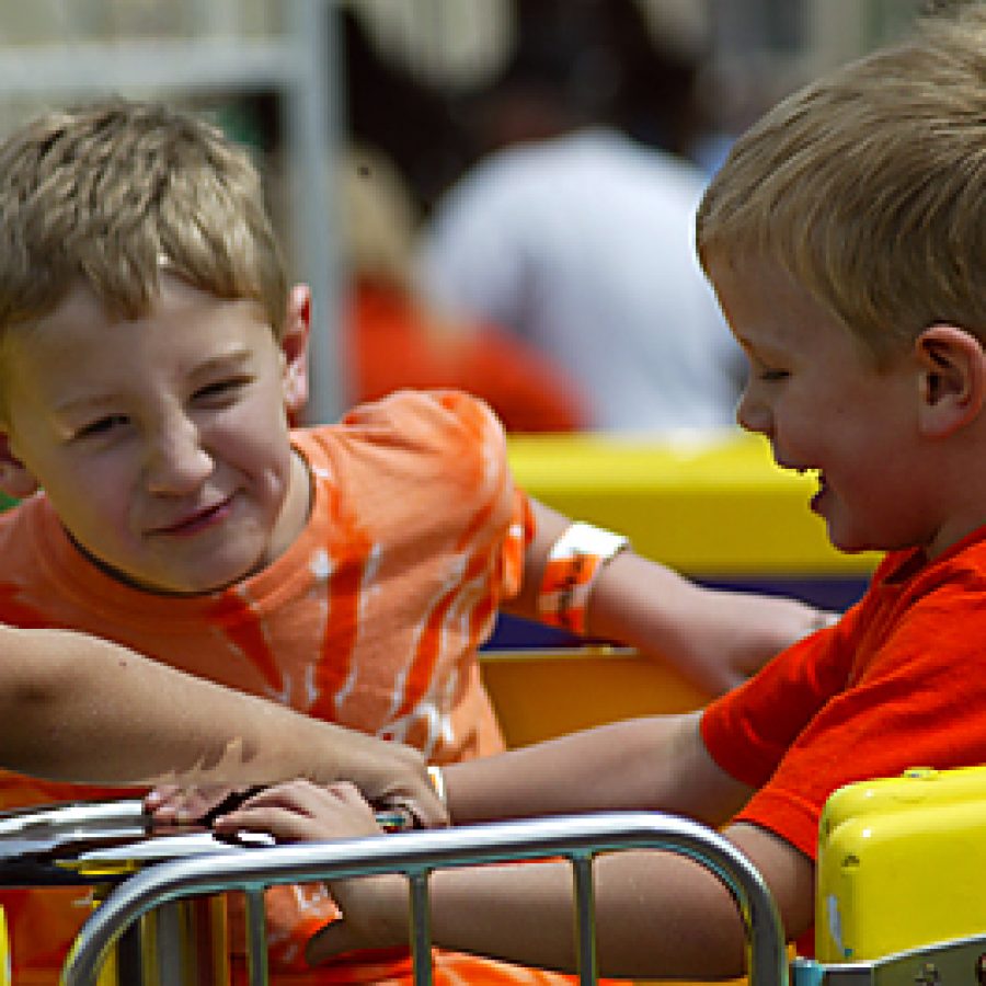 The looks on their faces explain why Quinn, left, and Kyle Sunderland, both 3, of Fenton, enjoy one of the carnival rides at the 2010 Lindbergh Spirit Festival. The 2011 festival will take place Saturday, May 21, and will mark the events 20th anniversary. William Cooke photo