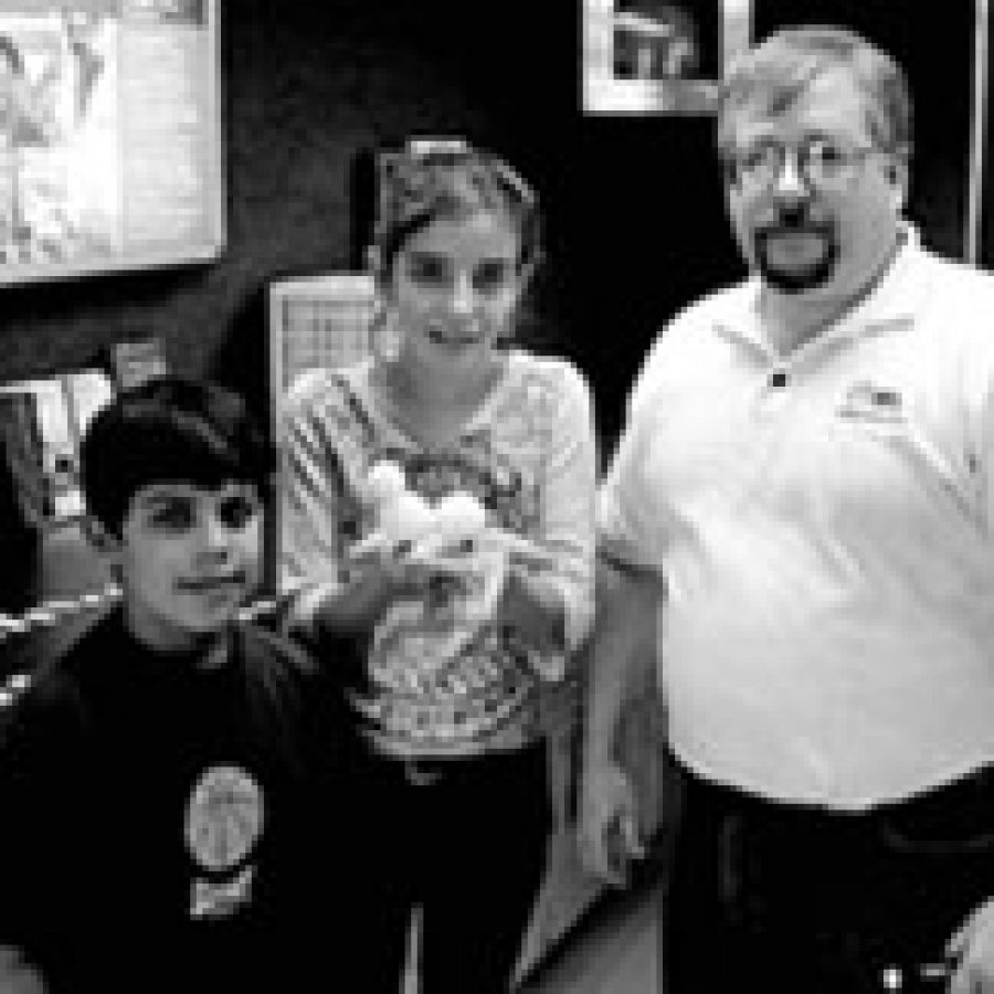 Diego Chavez and Amela Hadzic were among the Buerkle Middle School sixth-graders participating in learning activities in the St. Louis Community College Mobile Tech Center with Richard Norris, senior project associate for biotechnology with the community college. 