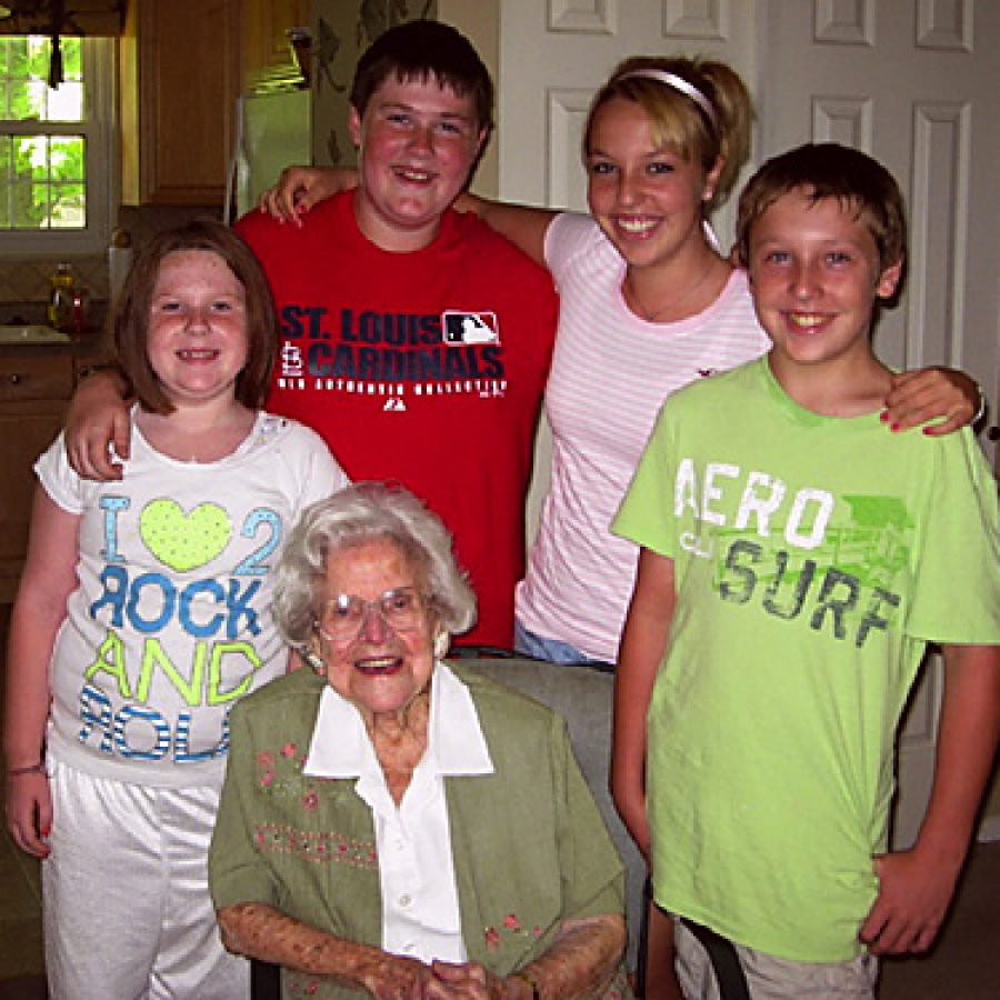 Verna Cole, who celebrated her 100th birthday Saturday, is shown with four of her 10 great-grandchildren. Standing, from left, are: Sammi Stolle, Alex Stolle, Sydney Freukes and Steven Freukes.