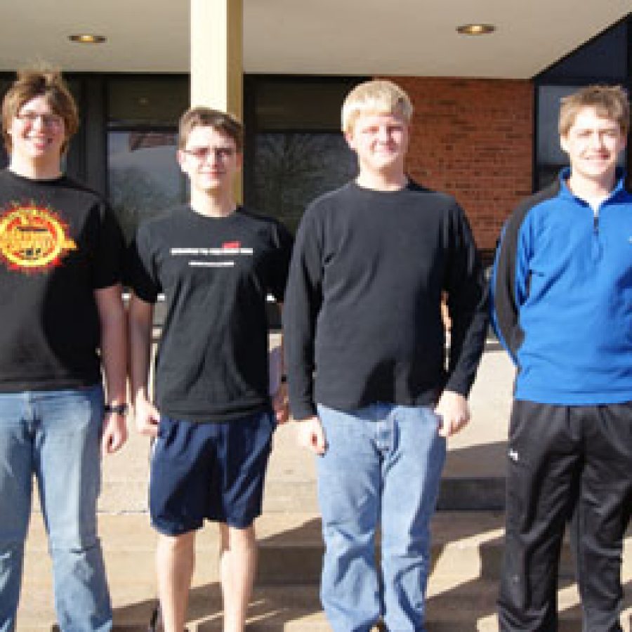 From left, Oakville High School seniors Brandon Daake and Michael Wiethop, sophomore Michael Menkhus and senior Kirt Daniels captured the regional title of the 2011 WorldQuest Competition during a tournament and will advance to the national competition with an all-expenses paid trip to Washington, D.C.