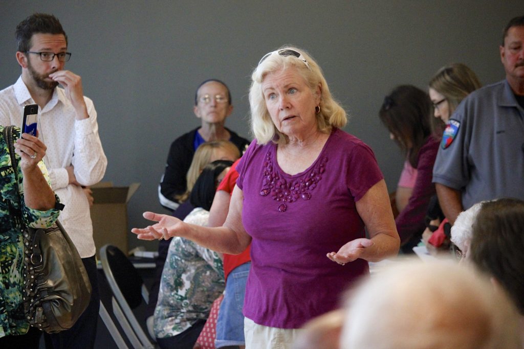 Resident Penny Kelley questions St. Louis County Assessor Jake Zimmerman on how she is supposed to afford an increase in taxes as a result of increased property values after that years reassessment during a town hall at The Pavilion at Lemay in 2019. Kelley said that she lives on a fixed income.